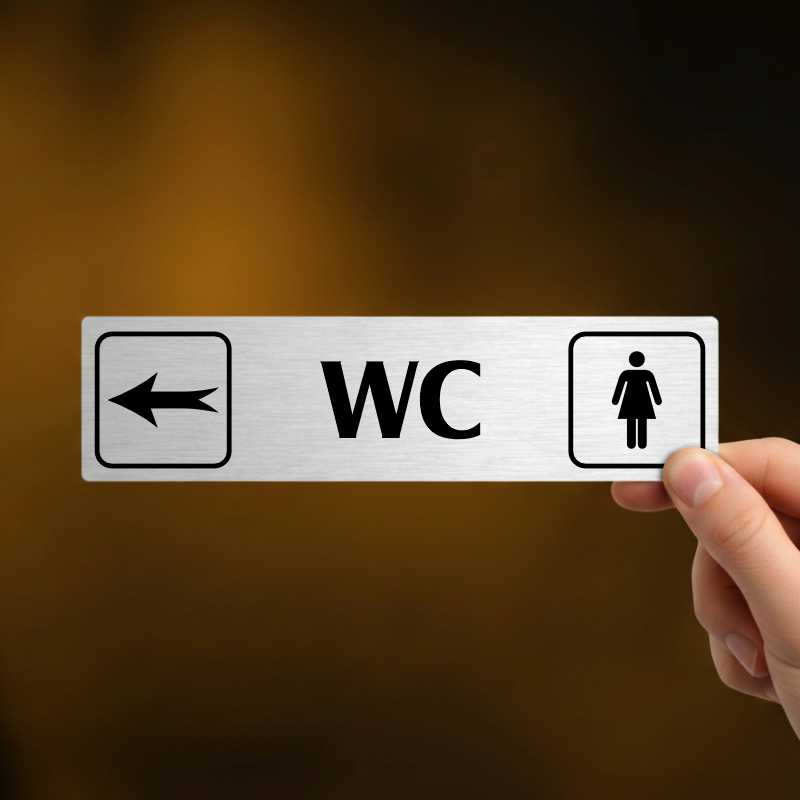 WC ženy vlevo, stříbrná cedulka, 180x45mm
