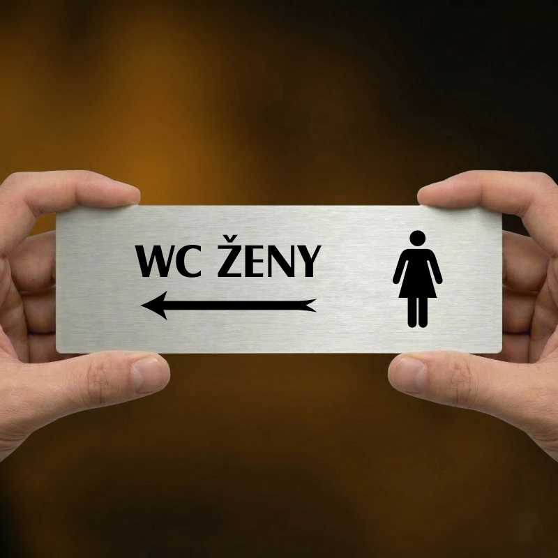 WC ženy vlevo, 200x66mm, stříbrná popiska s rámečkem