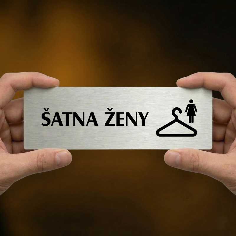Šatna ženy, 240x79mm, zlatá popiska s ozdobou uprostřed