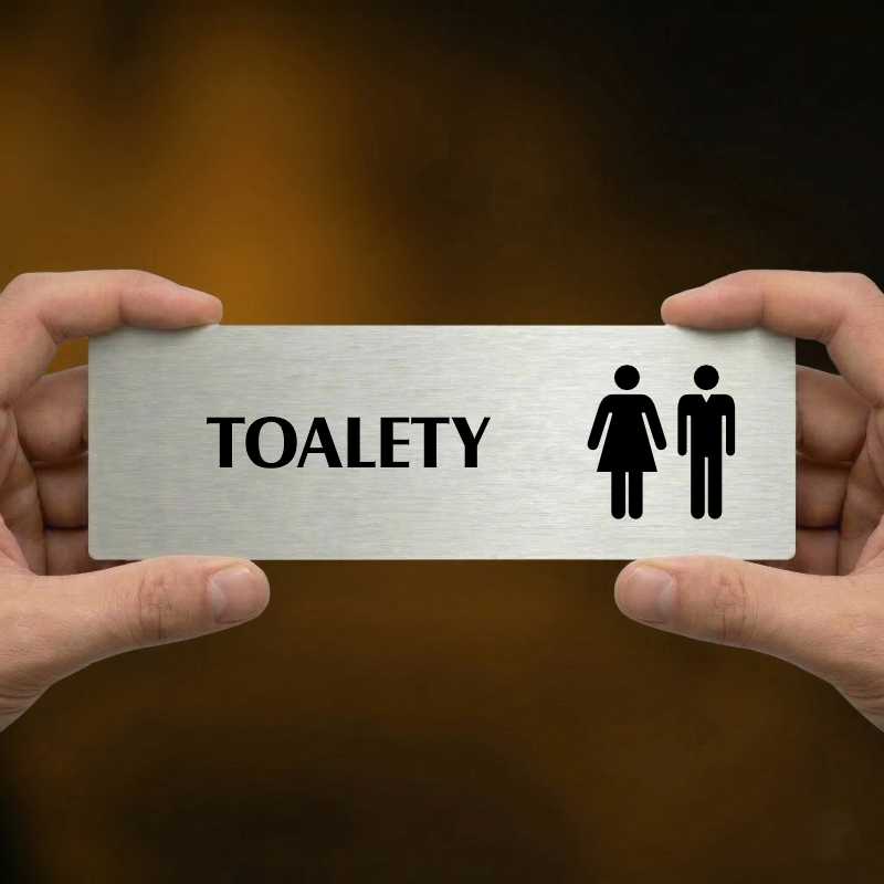Toalety společné, 240x79mm, stříbrná popiska s imitacemi šroubků