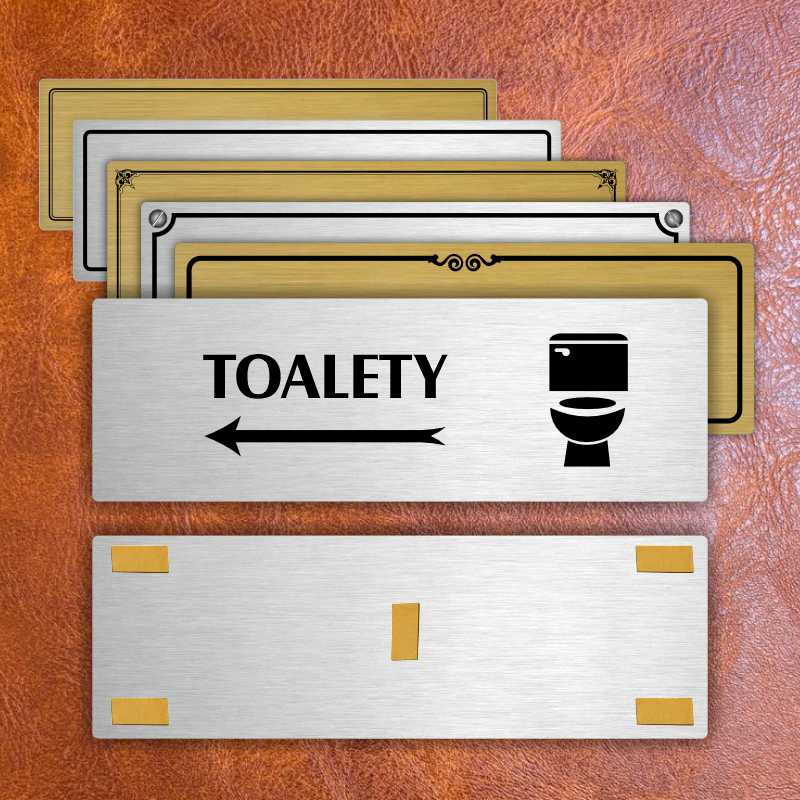 Toalety vlevo, 200x66mm, zlatá popiska s rámečkem