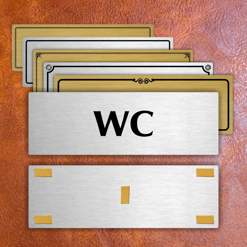 WC, 240x79mm, zlatá popiska s imitacemi šroubků