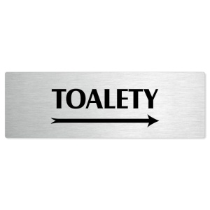 Toalety vpravo, stříbrná popiska na dveře