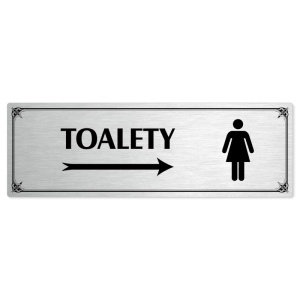 Toalety vpravo ženy, 240x79mm, stříbrná popiska s okrasným rámečkem  